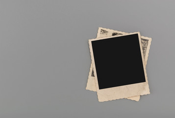 Blank vintage photos on grey background