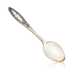 Antique silver spoon close-up on isolated white background