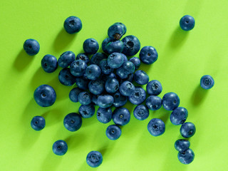 blueberry berry on a green background. summer and vitamins