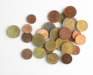 European Euro coins spilled on white surface