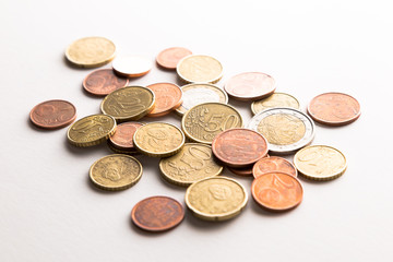 European Euro coins spilled on white surface