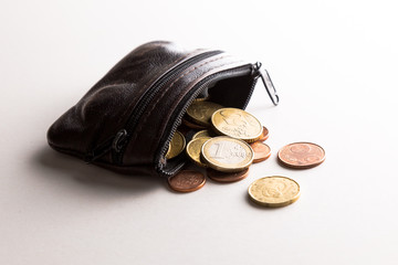 spilled coin purse with euro coins