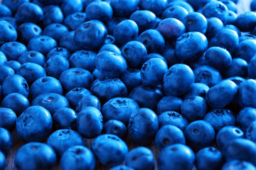 Blueberries on the table as a texture, background and pattern. Vitamins and berries