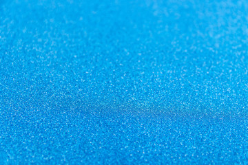 Brilliant shiny backdrop from textile. Shimmer denim paper.