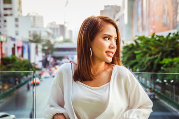 Fototapeta premium Beautiful woman smile portrait and traveling in the city
