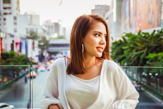 Beautiful woman smile portrait and traveling in the city