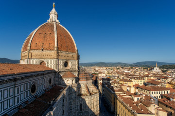Fototapeta na wymiar Florence city skyline, Italy. Aerial cityscape view from Santa Maria del Fiore cathedral (Basilica of Saint Mary of the Flower) in the day