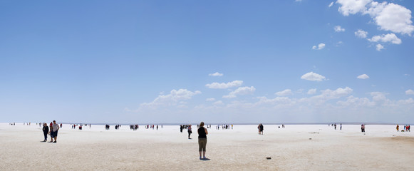Turkey: people in the distance walking on the salt expanse of Lake Tuz, Tuz Golu, the Salt Lake, the second largest lake in Turkey and one of the largest hypersaline lakes in the world
