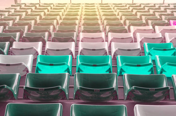 color chairs in football stadium background
