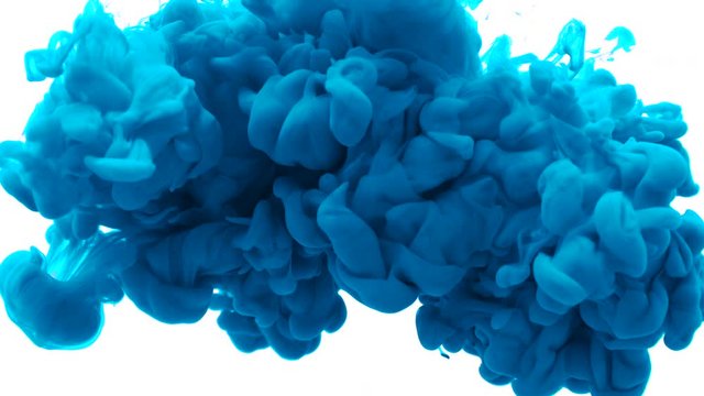 Blue color paint ink drops in water slow motion video with copy space. Inky cloud swirling flowing underwater. Abstract isolated smoke explosion