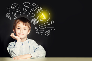 School boy with lightbulb on background. Idea concept