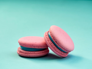 Colorful macarons on a blue background