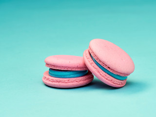 Colorful macarons on a blue background