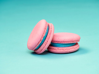Colorful macarons on a blue background