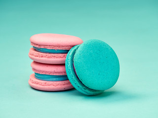 Colorful macarons on a blue background