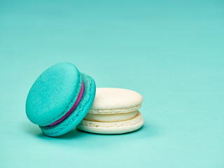 Colorful macarons on a blue background