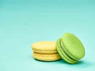 Colorful macarons on a blue background