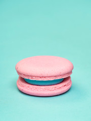 Colorful macarons on a blue background