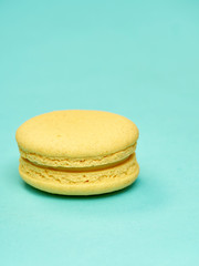 Colorful macarons on a blue background