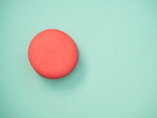 Colorful macarons on a blue background