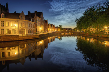 Fototapeta na wymiar Noctilucent clouds (night shining clouds) at city Bruges (Brugge) old town in Belgium in the dusk, Europe