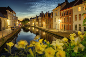 Noctilucent clouds (night shining clouds) at city Bruges (Brugge) old town in Belgium in the dusk, Europe