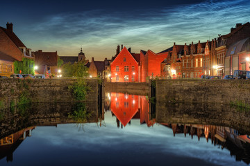 Noctilucent clouds (night shining clouds) at city Bruges (Brugge) old town in Belgium in the dusk, Europe