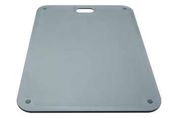 new gray cutting board made of plastic, on a white background, vertical layout