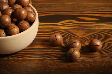 macadamia nuts lie on a black background