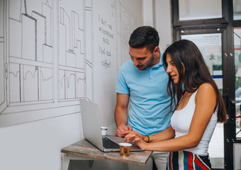 Cute couple having coffee together in cafe