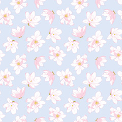 White magnolia seamless pattern on pastel blue background