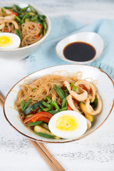 Traditional Asian stir fry with noodles, seafood and vegetables.