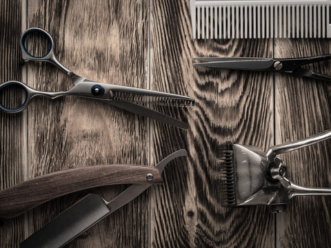 barber shops tools on wooden desk. pasteurized image