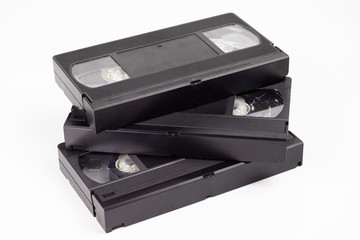Three old black video cassettes.