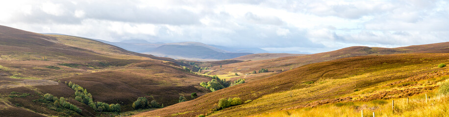 Fototapeta premium A scenic panorama of Cairngorms national park highlands landscape in autumn season, Scotland