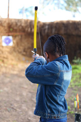 Man shooting at archery target