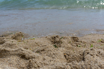 Beach close-up: sand and waves