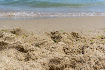 Beach close-up: sand and waves