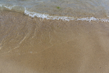 Beach close-up: sand and waves
