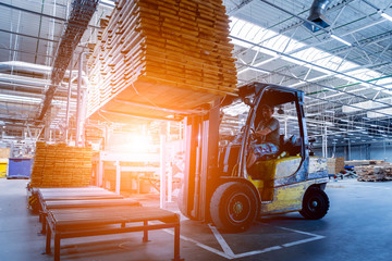 Forklift loader in storage warehouse ship yard. Distribution products. Delivery. Logistics....
