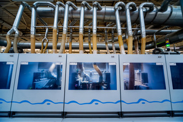 Production line of the wooden floor factory. CNC automatic woodworking machine.