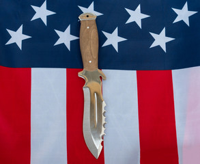 hunting knife american flag flat lay on gray background. United States Gun Laws - Guns and weapons/