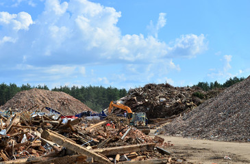 Industrial waste treatment processing plant. Landfill with industrial waste. Construction waste process, concrete recycling, crushing and recycling of construction mixed waste and demolition material