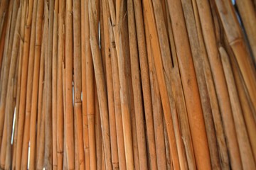 The texture of the parasol of natural straw color