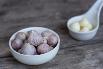 Top view of herbal vegetable ingredients, fresh garlic, on old wooden table, cooking preparation concept