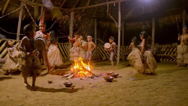 Traditional Indigenous Ceremony In The Jungle By Night Around The Fire In Ecuador