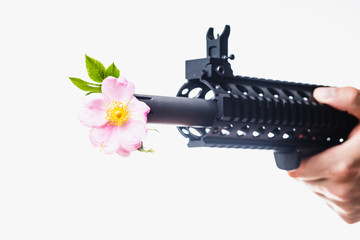 AR-15 Assault Rifle with Flowers Coming Out of Barrel