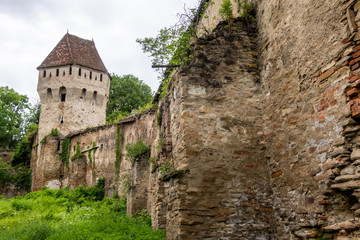 Medieval wall and Tinsmiths' Tower (Turnul Cositorilor), ridden by bullet holes from an Hungarian siege, in Sighișoara, Transylvania, Romania