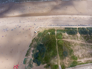 Aerial photo of the British seaside town of Skegness in the East Lindsey a district of Lincolnshire, England, showing the beach and pier on a beautiful sunny day.