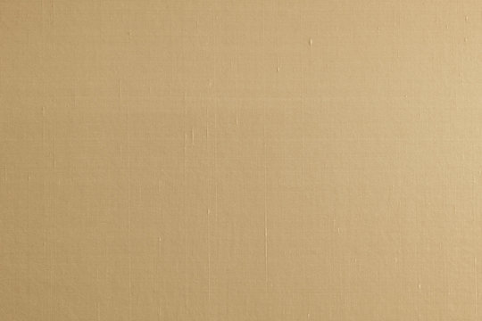 Cotton silk fabric wallpaper texture pattern background in light yellow gold beige brown